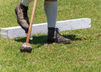 Scottish games - hammer throw. Showing The bladed boots